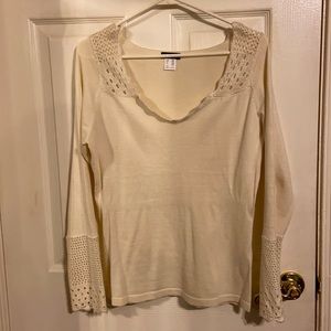 Woman’s new cream sweater